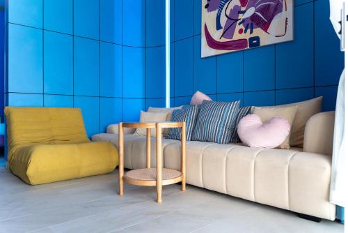 a living room with a couch and a side table at LOVE beach club Koh Samui in Chaweng