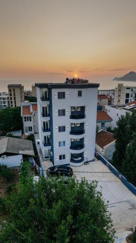 a white building with a fire truck on top of it at Lux DAM Apartments in Bar