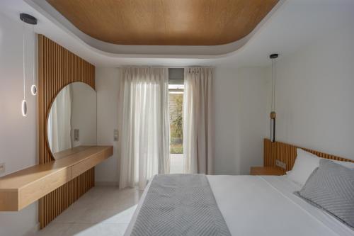 Ένα ή περισσότερα κρεβάτια σε δωμάτιο στο Adore Natural Retreat by Estia