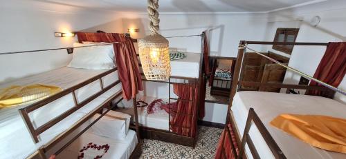 Postel nebo postele na pokoji v ubytování Hostel Dar Ben Youssef