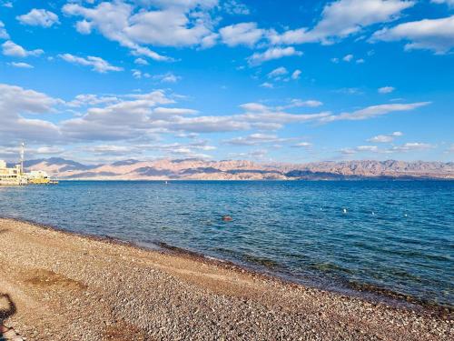 a body of water with mountains in the background at Steigenberger Hotel & Nelson Village, Taba in Taba