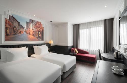 Ένα ή περισσότερα κρεβάτια σε δωμάτιο στο Luxe Paradise Premium Hotel Pham Hong Thai