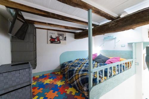 a bedroom with a bed with a lego floor at Radici Etrusche Sutri in Sutri
