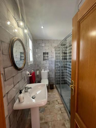 a bathroom with a sink and a shower at Casa Pedro in Benaoján