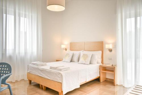 A bed or beds in a room at Ammarèa B&B