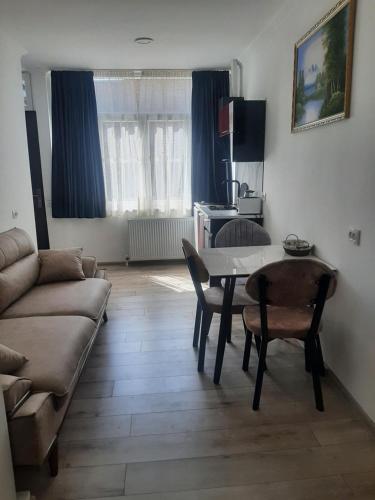 a living room with a couch and a table at "Vera old City" in Tbilisi City