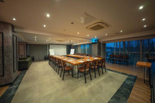 a large conference room with a long table and chairs at Alfa Suites & SPA in Sapanca