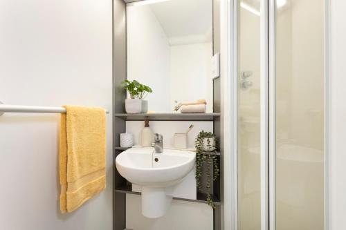 a bathroom with a sink and a shower at Unite Students - Chalmers Street - The Meadows in Edinburgh