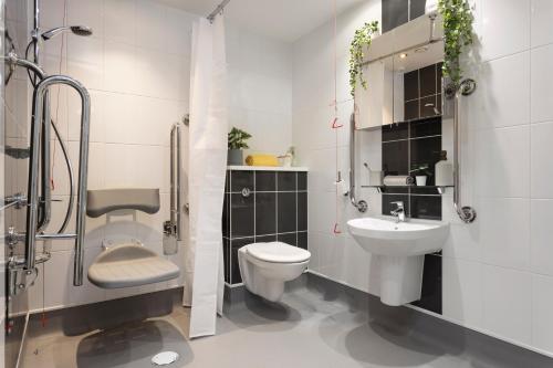 a bathroom with a toilet and a sink at Unite Students - Salisbury Court in Edinburgh