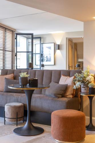 a living room with a couch and a table at Mougins Luxury Retreats in Mougins