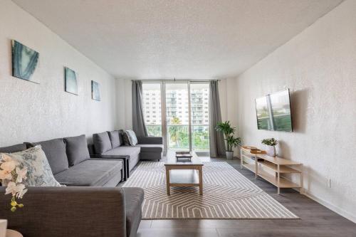 a living room with a couch and a table at Ocean Reserve Condominium in Miami Beach