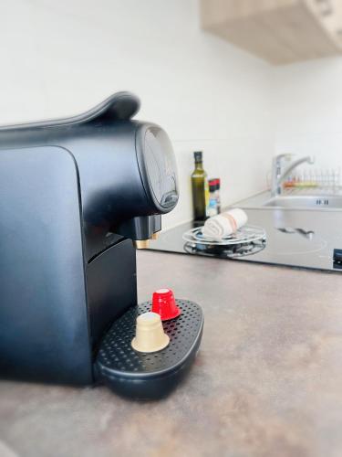 a camera sitting on top of a kitchen counter at Domus Via Domitia in Narbonne