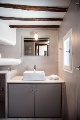 a bathroom with a sink and a mirror at Villa Cyclades Naxos in Naxos Chora