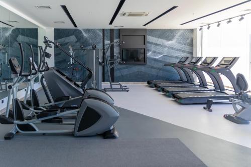 a gym with treadmills and elliptical machines at Crystal Centro Resort - Ultimate All Inclusive in Lara