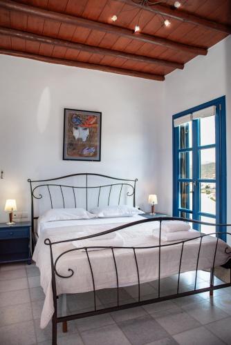 a bedroom with a large bed in a room at Villa Cyclades Naxos in Naxos Chora