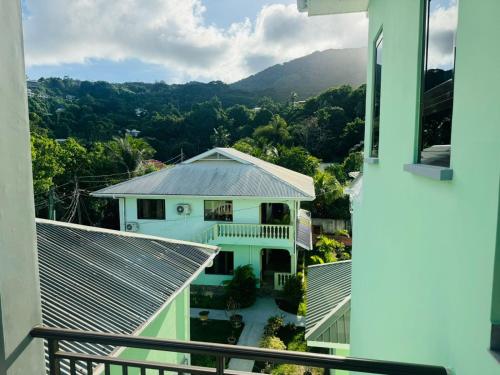 a view from the balcony of a house at Green Palm Self Catering in Anse aux Pins