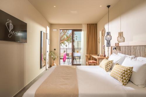 Ένα ή περισσότερα κρεβάτια σε δωμάτιο στο Hotel Pyriá