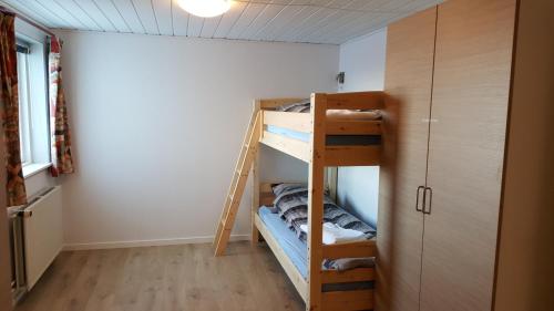 a room with a bunk bed and a ladder at Vandrehuset 2 og 3 in Nuuk