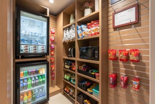 a store with a soda machine in a store at Holiday Inn Express & Suites Vaughan-Southwest by IHG in Vaughan