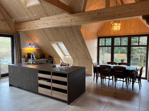 a kitchen and dining room with a table and chairs at Ferienwohnung in den Dorfwiesen in Gersfeld