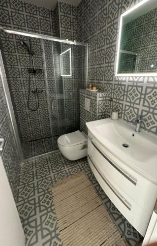 a bathroom with a sink and a toilet at Lemon Navy house in Vodice