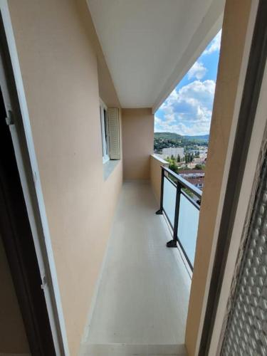an empty balcony of a building with a view at Appart Familial, prox Gare & Centre-ville, garage in Besançon
