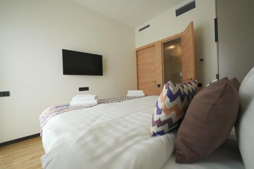 Cama o camas de una habitación en 4Guest Hotel