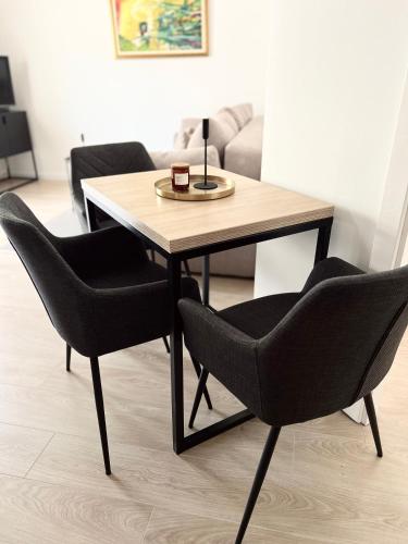 a table with two chairs and a lamp on top of it at Apartments Mrdak in Bar