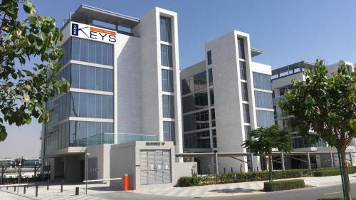 a building with a keys sign in front of it at Your Keys Holiday Homes in Dubai