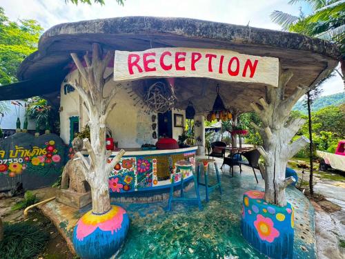 a pretend restaurant with trees in front of it at Clay House Chiang Mai By Alphatel in Chiang Mai