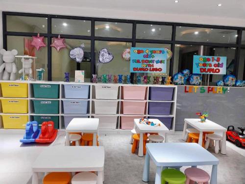 a toy store with tables and chairs in a room at Keis Place Tagaytay in Tagaytay