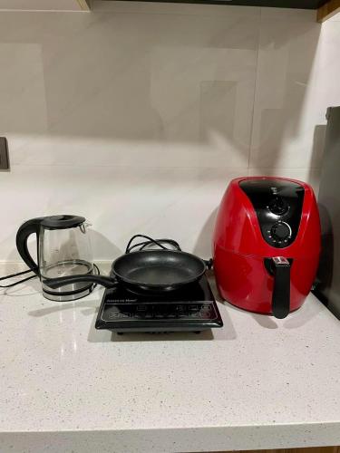 a toaster sitting on a counter next to a toaster at Keis Place Tagaytay in Tagaytay