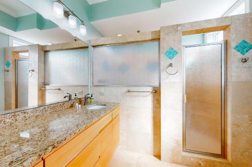 a bathroom with a shower and a sink at Boundless Horizons in Surf City