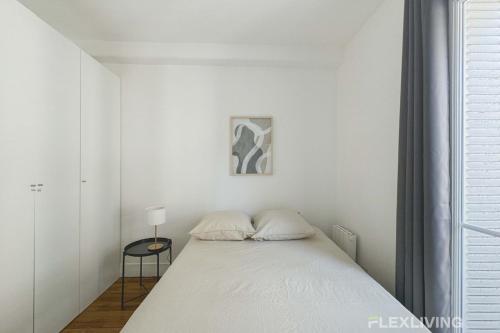 Postel nebo postele na pokoji v ubytování Flexliving - Room - Lamarck