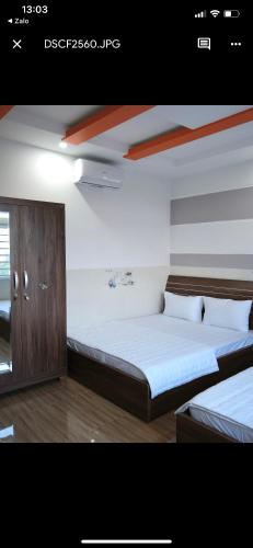Postel nebo postele na pokoji v ubytování Khách sạn Mỹ Uyên