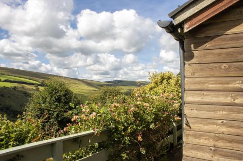 a view of the rolling hills from the balcony of a house at Hillway Lodge, Withypool in Withypool