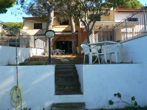 a staircase leading to a house with a table and chairs at MAtti1965 in Scalea