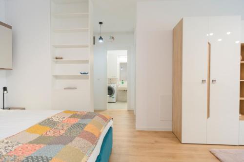 Ένα ή περισσότερα κρεβάτια σε δωμάτιο στο Vulcan Residences - Premium Apartments
