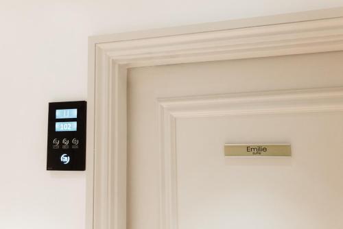 a door with a sign that reads entry at Leicester House Hotel in London