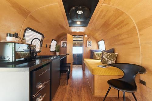 a kitchen and living room in a tiny house at Acres Landing in Desert Hot Springs