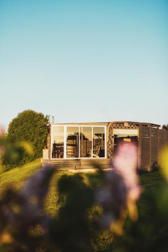 a person is walking in front of a building at Doles skati, kubls - iekļauts cenā in Salaspils