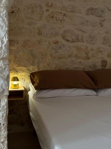 Ένα ή περισσότερα κρεβάτια σε δωμάτιο στο Al Murigini - Casa Vacanze