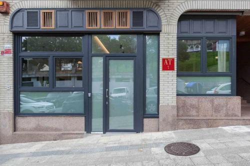 a store front with glass doors on a building at LUR Apartments Getaria in Getaria