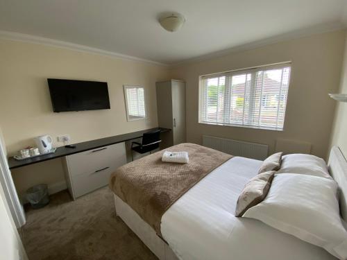 Katil atau katil-katil dalam bilik di Parkside Guest House