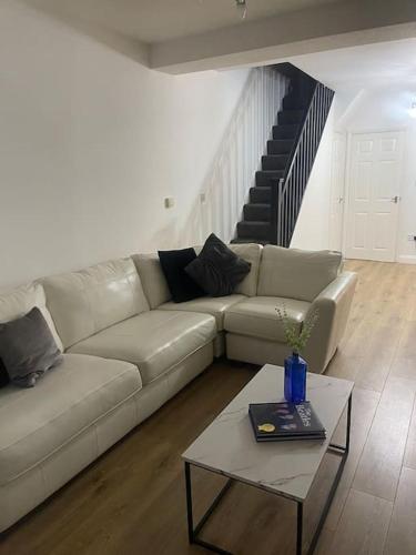 a living room with a couch and a table at Birks road in Cleator Moor