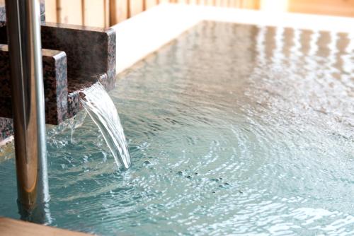 a water fountain in a swimming pool at Umiusagi in Higashiizu
