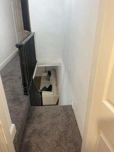 a stairway with a toilet in a room at Birks road in Cleator Moor