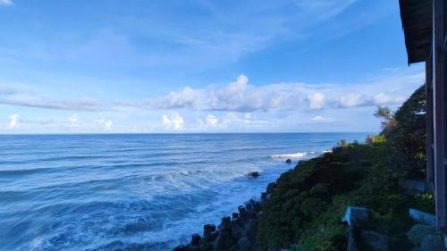 a view of the ocean from a house at Come and go seaside B&B in Fengbin