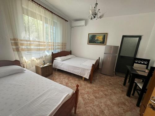 Postel nebo postele na pokoji v ubytování Villa Kurti
