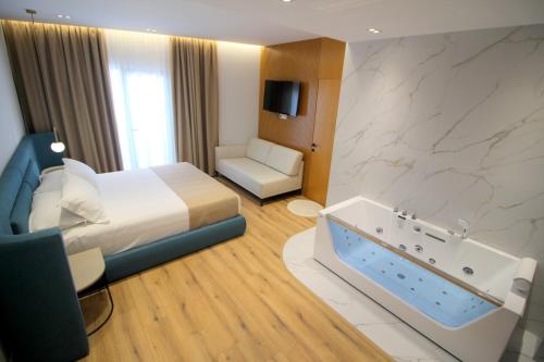 Postel nebo postele na pokoji v ubytování Hotel Strora